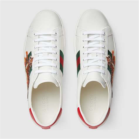 gucci leather embossed ace sneakers|Gucci ace tiger sneakers.